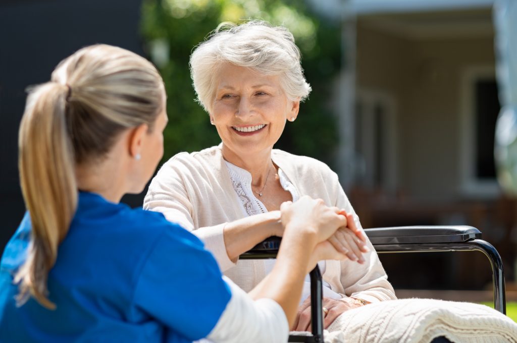 person-centered: elderly patient assisted by nurse