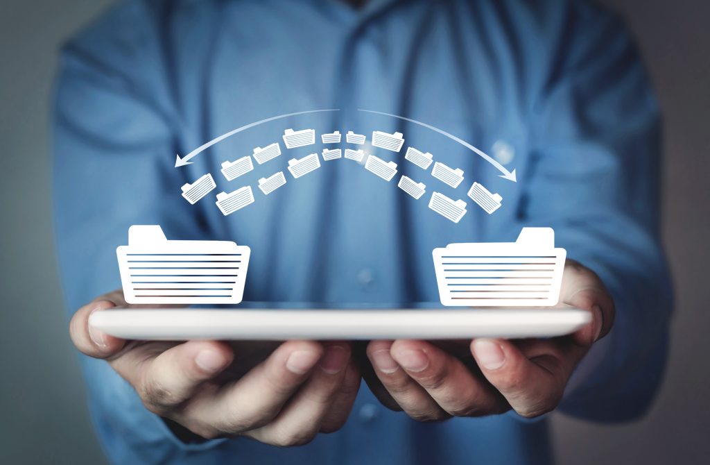 man holding data folders transferring