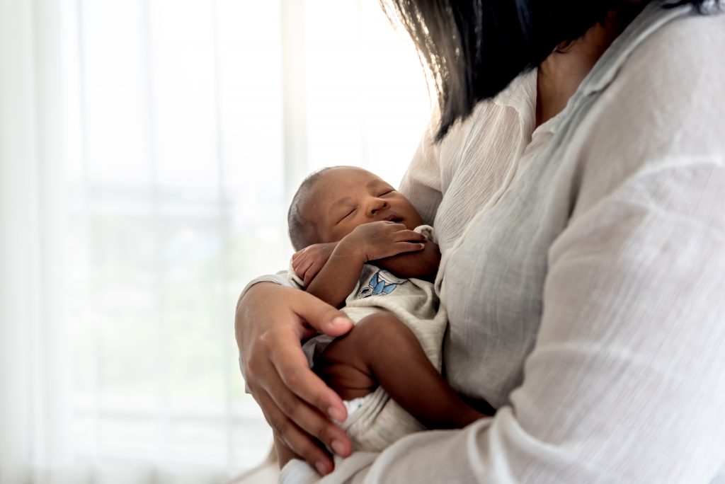 Portrait of African American Newborn with mother