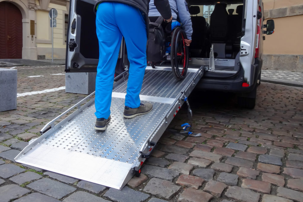 opportunity to help: loading wheelchair into van 
