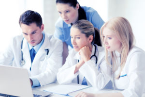 healthcare, medical and technology concept - group of doctors lo